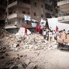 Trabajadores humanitarios entregan ayuda en vecindarios de Aleppo, Siria. Foto: ACNUR