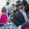 Refugiados sirios que cruzaron a Iraq huyendo de la violencia en un centro de ACNUR. 